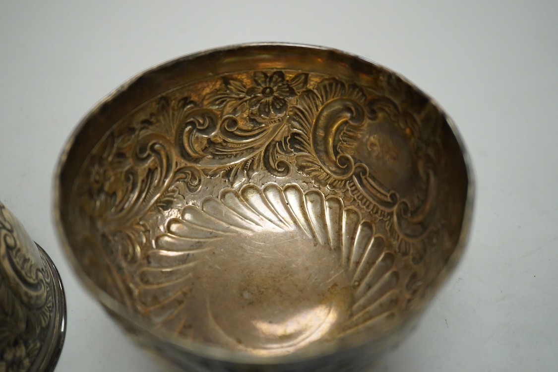 A pair of Edwardian repousse silver pedestal bowls, by Charles Boyton & Son Ltd, London, 1906, diameter 11.4cm(a.f.), 6.9oz and a plated two handled dish.
